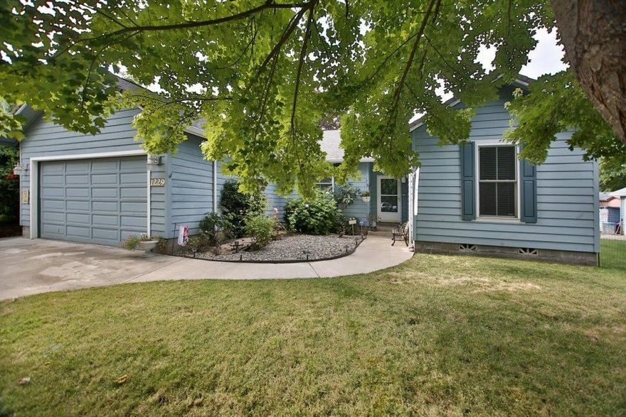 Beautiful home ready for new owners! Built in 2004, this 1400 sqft, 3 bed, 2 bath split bedroom floor plan encompasses a large living room with vaulted ceilings and a bright open kitchen with double sinks, eat-in bar, plus brand new gas range and dining area with glass doors to the back deck and hot tub, perfect for entertaining family and friends on a warm summer day! Three bedrooms including the spacious master, with walk in closet and private ensuite bath, guest bathroom and laundry room complete the home. Additional features include, energy efficient gas heating and air, security system, ceiling fans, in ground sprinklers, finished two car garage with storage space, and a detached one car garage/shop with carport for toys and hobbies! All on a nice size lot (.22 acre) off the street with city services and district 7 schools. Very convenient location close to shopping, restaurants, and medical facilities. You'll be proud to call this one home!