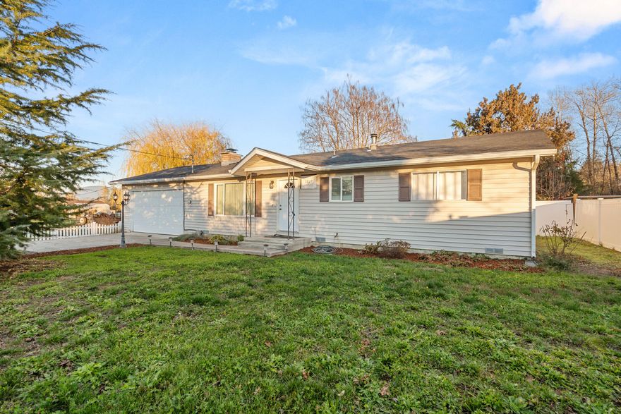 Well-kept 3 bedroom, 2 bath home on a .65-acre lot. Functional floor plan with two bedrooms and a full bath on one side of the home, plus a third bedroom/office off the main hall. Spacious living room with a brick fireplace and large picture window. Remodeled kitchen features granite counters, updated cabinetry, double ovens, and a clean flow into the dining area with slider to the backyard. Property includes mature landscaping, open lawn space, and a pond feature for added appeal. Plenty of room for gardening, RV parking, or future outdoor projects. One-level living with a comfortable layout and usable acreage.