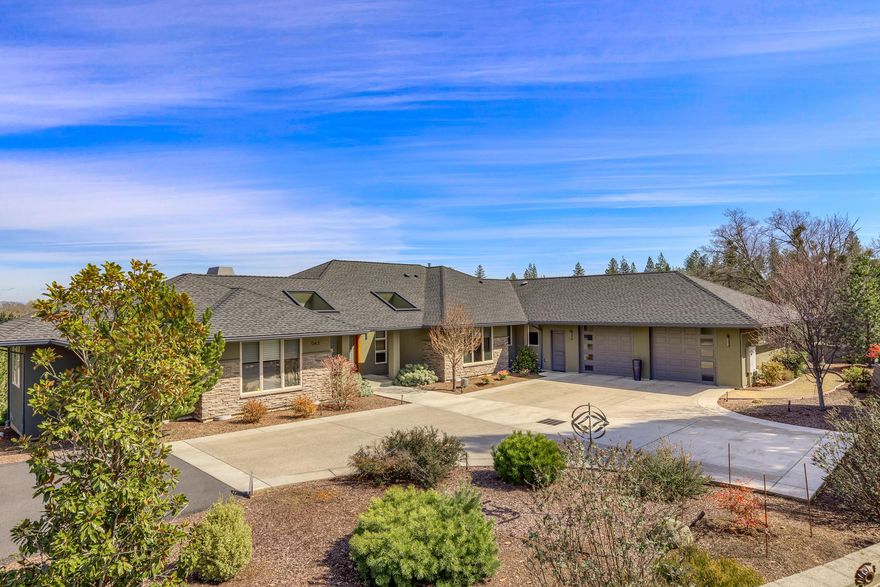 Gorgeous single level home built by Doris Construction in Jacksonville with City water on 2.04 acres w/views of Mt Mcloughlin, Roxy Ann Mts. One owner view home w/3 master suites + beautiful dbl door library/office w/built in bookcases. Lg custom windows throughout, dbl 8' mahogany doors & trim in entry. Lg tile floors in entry, formal dining, kitchen, breakfast rm, baths, hall ways. Beautiful granite counters in main master, kitchen w/ lg island w/ 2nd sink, wine refrige, sub zero, Thermador 6 burner gas cook top, convection wall oven, warming drawer & built in microwave. Kitchen is open to great rm w/ floor to ceiling slate tile gas glass & stove fireplace. Lg outdoor living area w/ covered deck, wrap around to master suite. Architectural flairs w/ stucco exterior & stone accents, lg 735 SQ FT finished garage w/ storage shelves & work area w/sink. Lg laundry/hobby rm w/ built in desk. 12X12 storage rm + raised garden beds, designer lighting, sound system, hunter Douglas blinds & more