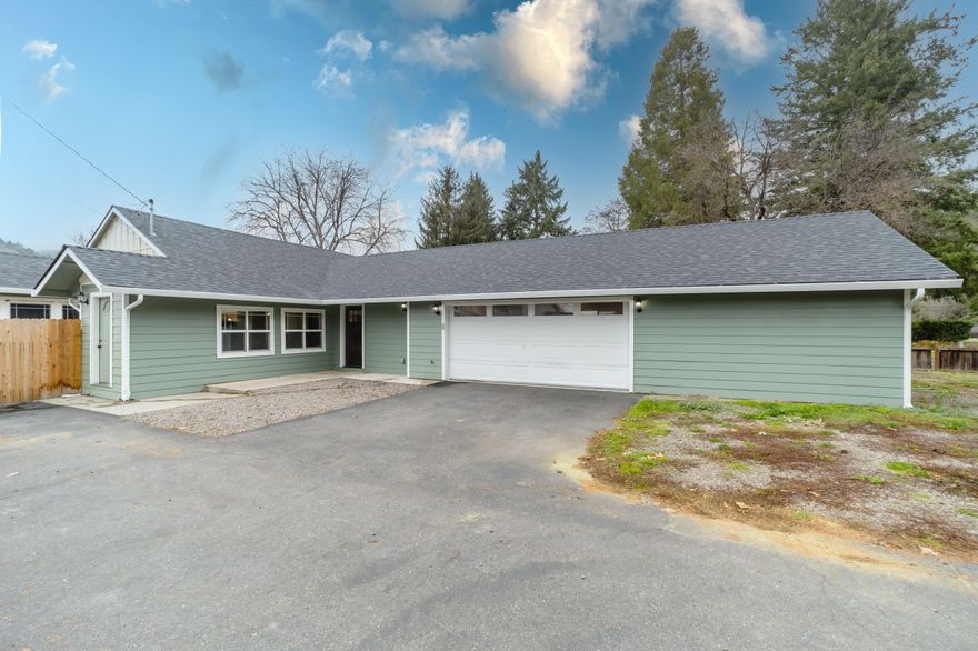 Move over HGTV- this home in Rogue River has all the things you want! Including a large lot, great location and remodeled in 2021 with a sparkling white kitchen with a huge island, beautiful granite, main bedroom suite includes a huge en suite with custom tiled shower and French doors. This home leaves nothing to desire, there's a large, fenced yard and plenty of space + RV parking. With three proper bedrooms plus a bonus room that could be a home office/gym/ man cave  or whatever suits your needs. Location is great, just 20 minutes to Medford and 15 to Grants Pass- you can enjoy the small town atmosphere and a short commute either direction. You'll fall in love with this special home.
The remodel included a new roof, new yard & deck, new siding, new paint, new gutters, new HVAC system, new luxury vinyl plank flooring, new stainless steel appliance package, new cabinets and gorgeous granite counter tops. it's like a new home.  Square footage includes  bonus room.