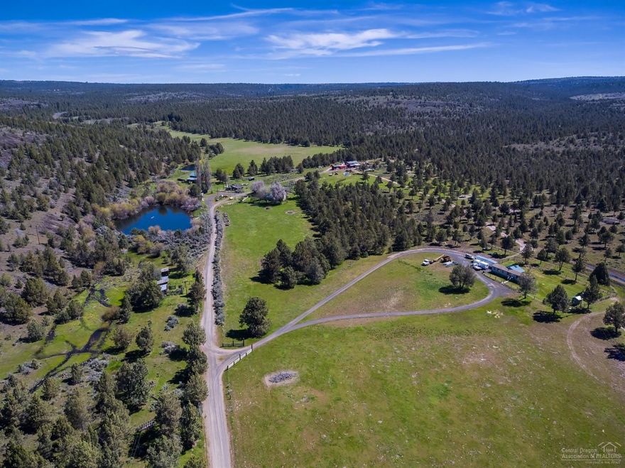 Dry Creek Ranch is a one of kind livestock and recreational property with potential for future development-RRM5 zoning. Ranch is 1671 deeded acres with seasonal water rights, 3500+/- acres of BLM/State grazing allotments (324 AUMS), 3 ponds, catch ponds for livestock water and seasonal creek. Improvements include: two ranch homes, barn, two shops, fenced, cross fenced and gated. Own an entire valley with abundant wildlife. Property is 7 miles from Prineville and Prineville Reservoir.