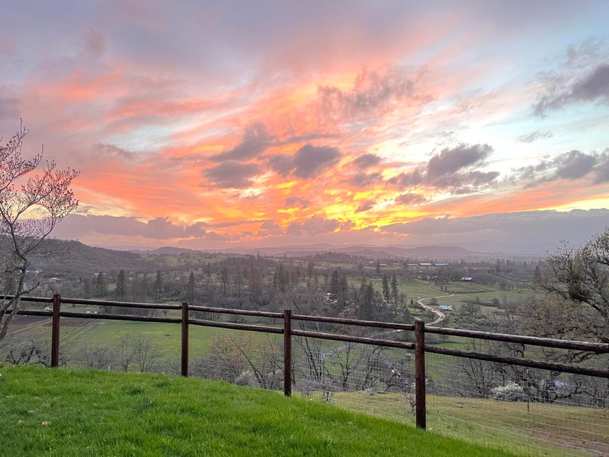 Get ready to be awed by one of the most Amazing 360° hilltop views in Jackson County. Enjoy privacy but a quick drive to shopping and dining.  This spacious home features 2880 ft.², situated on over 21 acres (two parcels) including a barn.  
Many improvements include a custom kitchen with imported countertops, custom cabinets with soft-close doors, pull-out drawers and top-of-the-line appliances. All new flooring throughout. Airy and bright, the living room has a beautiful fireplace and the family room is enormous, with both having vaulted ceilings. My favorite is the smooth drywall finish and soft paint colors. One bathroom has been completely redone from the ground up, a new a/c in 2015 and a complete water filtration system.  The garage boasts 1200 s.f. and has a shower and toilet. No showing between 12:00 – 2 pm, thanks.