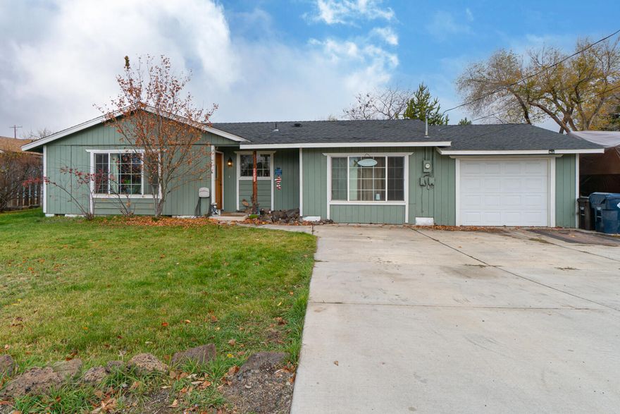 Don't miss this adorable Ranch style home located in SW Redmond! A quaint covered entry leads into the home's main living area. Warm laminate flooring throughout the living room w/ large windows for plenty of natural light. Tiled kitchen w/ eating area, plenty of cabinetry, & sliding glass doors that lead directly out onto the covered back patio area. Three carpeted bedrooms share a full bath w/ tub & shower combo w/ tiled flooring & tiled countertops. Garage area has currently been converted partially into a spare entertainment room / storage area to also include the washer/dryer hookup. Home sits on almost a 1/4 acre w/ mature landscaping, greenhouse & rustic woodshed w/ observation deck above. Mt Jefferson can be seen from upper deck. RV Parking available. Don't miss!!!