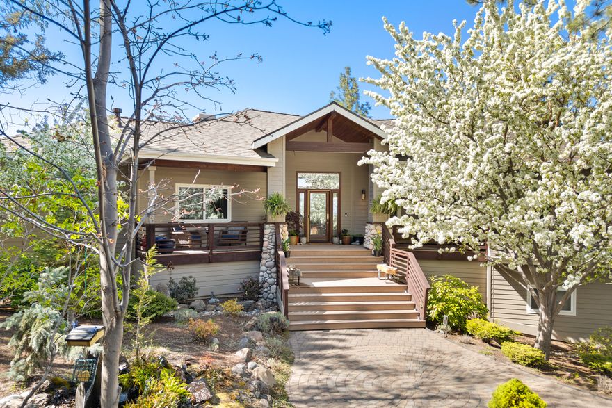 Stunning single-level home with Cascade Mountain views and modern upgrades!  This 2,468 sq ft updated home sits on a .65-acre lot and features an open floor plan, 12' ceilings in the great room and primary suite, expansive windows, and a brand-new west facing wrap-around deck taking in beautiful sunrises and spectacular sunsets, a bird watcher's paradise!   Enjoy a gourmet kitchen, connecting the living and dining areas, perfect for everyday living and entertainment alike. Luxurious primary suite with fireplace, walk-in closet, and artistic spa bath. Includes 3 bedrooms plus an office (easily a 4th bedroom), 2 full baths, and a half bath off the 3-car garage. Approx. 675 sq ft of climate-controlled storage offers potential for an office, hobby room, or shop. Mature landscaping, charming gazebo, in a private tranquil setting. Move-in ready and full of character, this exceptional home blends luxury, comfort, and nature's beauty in perfect harmony.