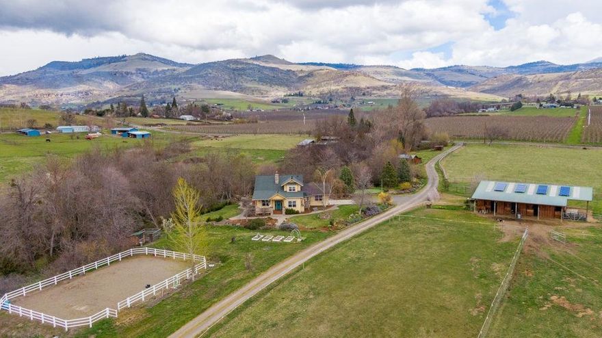 Rare opportunity with ideal set up for multi-family living. The 4 bedroom home has a main level master suite nicely separated from the other bedrooms, 3,280 SF, cherry hardwood floors, open kitchen with Cambria countertops, impressive great room features a wall of windows, woodstove and adjacent library. The second home is three bedrooms and 1,568 SF. It features a two story great room, hardwood and tile flooring, charming kitchen with granite countertops, Hickory cabinets, light filled dining room and direct access to the expansive deck, stone paths, hot tub and year round Knutchen Creek. 15 of the 33 fenced & cross fenced acres are TID irrigated. 6 acres of hay. 36'x48' four stall barn w/ tack & tool rooms, interior storage, rubber mats & poured concrete flooring & covered RV parking. 80'x55' arena w/ decomposed granite & sand footing, hay & wood sheds. Addtn'l RV pad w/ full hookups.