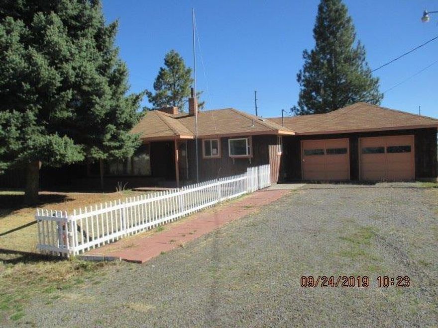 Country property on over two acres with outbuildings, small shop building and cross-fenced. The home needs updating and TLC, this is a sturdy-built home in a quiet location.