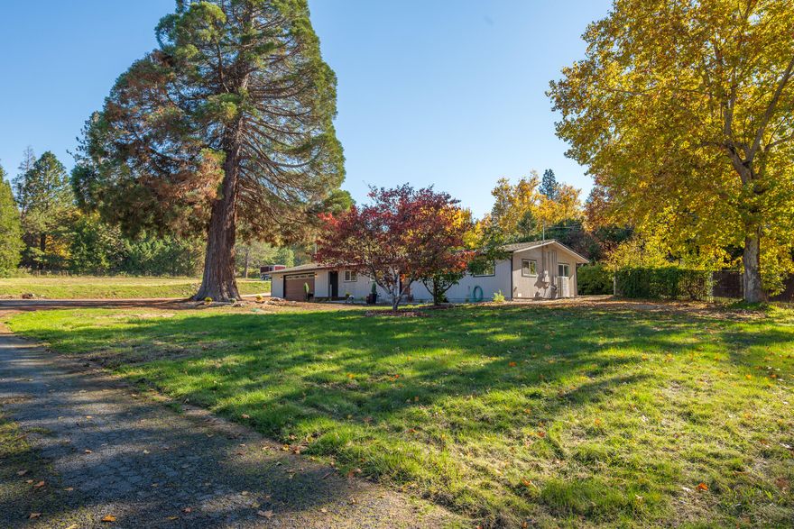 Move-in ready with all the big updates complete! 2547 Elk Lane offers 2,092 sq. ft. of single-level living with 3 bedrooms and 2 bathrooms on 1.13 acres at the edge of town. This refreshed ranch-style home features a new ductless heating/air system, updated kitchen with new appliances, all-new flooring, and fully remodeled bathrooms. The improved floorplan creates a functional flow for everyday living. Outside, enjoy fresh exterior paint, new gutters with downspouts, a new garage door, refreshed landscaping, plus a brand-new drilled well producing 46 gpm with district irrigation rights. The property also offers open, usable pasture land—ideal for animals, gardening, or simply enjoying a peaceful country setting.