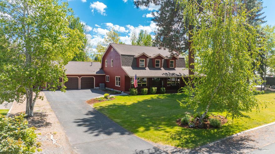 Welcome to this inviting and unique country-style home nestled on nearly half an acre in the desirable SE Bend Orion Estates. An open floor plan Great Room featuring vaulted ceilings and a cozy gas fireplace, creating a spacious and welcoming atmosphere. The primary bedroom is conveniently located on the main level, providing a private retreat, while two additional bedrooms and a loft space perfect for a home office await upstairs. Outside, the charm continues with a wrap around covered porch and a barn-like roof with dormers. The beautifully landscape dotted with towering Ponderosa Pines, and the French doors open to a private backyard that backs onto the COI Canal, which often feels like a serene river. Enjoy outdoor living on the inviting paver patio with a raised gas firepit,or tend to the gated garden area. This home combines rustic elegance with modern amenities, offering the perfect blend of comfort and convenience.