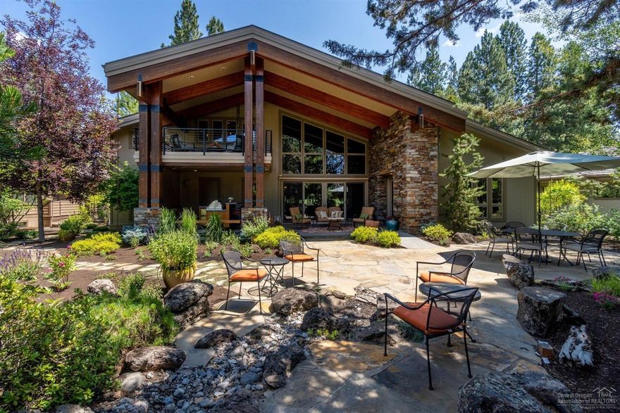 Exquisite Contemporary home on flat lot w/ mature landscaping, backs to Broken Top 4th fairway. Dramatic Grt Rm w/2 stry vaulted cedar ceilings; cstm etched glass high above, cstm stacked rock walls that continue outside, & floor to ceiling windows. Alder built-ins & cabinetry, radiant heated travertine & slate floors, 4BD & 4BA. Open floorplan for entertaining w/loft style wraparound area above w/office, library, & flex/Fmly Rm w/2nd wetbar & upper deck overlooking grounds & course. Ample chef's kitchen stocked w/finest appliances flows to Lg dining area. Convenient Lg Mud/Ldry Rm w/spaces for storage. 2nd staircase to upstairs guest suite. Main Mstr suite on ground Lvl w/beautiful views, rear patio access, see-thru FP to spa-like bath, & Lg w/i closet. 2nd ground Lvl Jr Master w/FP & pvt enclosed patio. 3rd ground Lvl bedroom facing mature trees. Outdoor kitchen & expansive landscaping. Covered paver patio, flagstones, firepit & trees providing a buffer from the course.