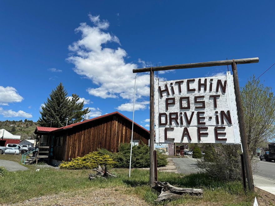 Commercial building for sale in Prairie City, Or! This building was home to the Hitchin Post Drive In Cafe for many years. Bring your enthusiasm and open it back up or use the building for any other endeavor you may have in mind. Sale will include blower system & grill, walk in cooler, frymaster deepfryer, Ice cream machine, Ice O matic flake ice machine, master bilt freezer (ice cream dipping cabinet), milk shake machine, 2 freezers, microwave, 8 barstools, 2 tables and 8 chairs, 3 inside picnic tables, 3 outside picnic tables, 3 compartment stainless sink, fire suppression system. Lots of equipment to help a new owner start their own restaurant/cafe. Excellent location, tons of parking and always was a favorite amongst the community and travelers passing through. 1380 sq/ft with two bathrooms, storage rooms, indoor & outdoor seating.