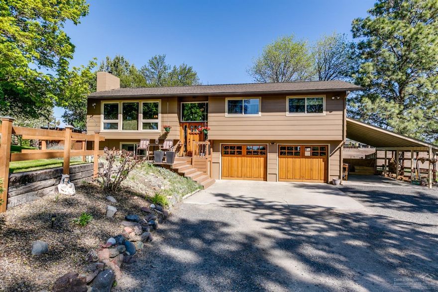 Great Home in the very desirable West Hills Subdivision. Home has mature landscaping with underground sprinklers.4 bedroom 3 bathroom with 2 fireplaces and attached double car garage with shop area. Covered RV parking and an additional large shop. Corner lot, fenced & irrigated property with sprinklers. Bring your animals!!