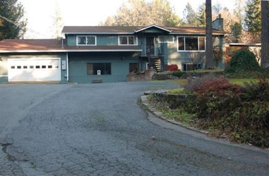 Nice Setting Among the Pines! Sitting on 1.03 of acres the home was built in 1975 and features 4 bedrooms, 3 bathrooms, approx. 3136 sqft., Three of the bedrooms and 2 baths are on the main level and 1 bedroom, 1 bath, family room and rec. room are in the daylight basement. Kitchen has granite counters and a hardwood floor, large living room with wood stove insert. Decks, patio and a wonderful inground pool. Guest house, attached 2 car garage, large shop and RV parking make this a special place.