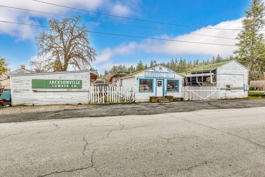 This is one of those iconic properties that is part of Jacksonville's history & the largest undeveloped commercial property in town w/ two tax lots totaling almost 1/2 acre. The property's prime central downtown location & HC zoning make it both extremely unique & desirable. The HC zoning allows for a wide variety of uses including but not limited to restaurant, retail, lodging & housing, & is located in the downtown Parking District. 
The property was last operated as the Jacksonville Lumber Company, which functioned as the town lumberyard for many years. A 720 sf office is located at the front of the property w/ a myriad of accessory structures to store lumber & other bldg materials.
Jacksonville is a National Historic Landmark town now known for a thriving cultural & epicurean scene. Named one of America's top 10 coolest small towns, Jacksonville is home to the Britt Music & Arts Festival, an incredible selection of shops & eateries, celebrated winemakers & outdoor opportunities.