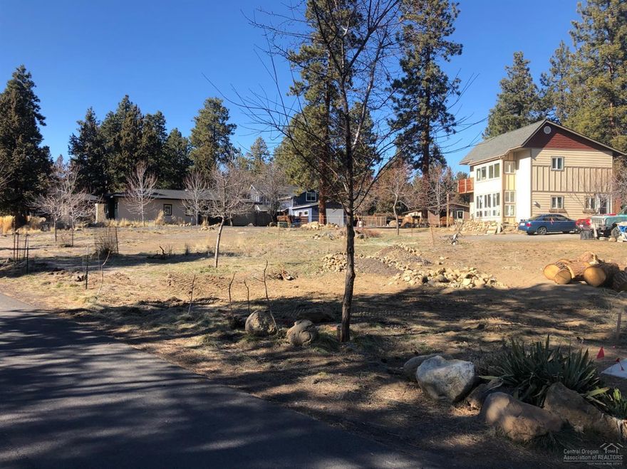 Build your dream home on this .15 acre south facing, corner lot located near the Deschutes River & trail in desirable Woodriver Village! Perfect location for those wanting to walk out their door to fish, float, paddle or hike/jog the trail. Less than a mile to restaurants & shops in the Old Mill and concerts at the Les Schwab Amphitheater. This unique neighborhood has mature pines, beautiful rock outcroppings and a campground feel. Don't miss the easy access to river/trail via the entrance on Cedarwood. Lots of new development happening! Don't miss this wonderful opportunity!