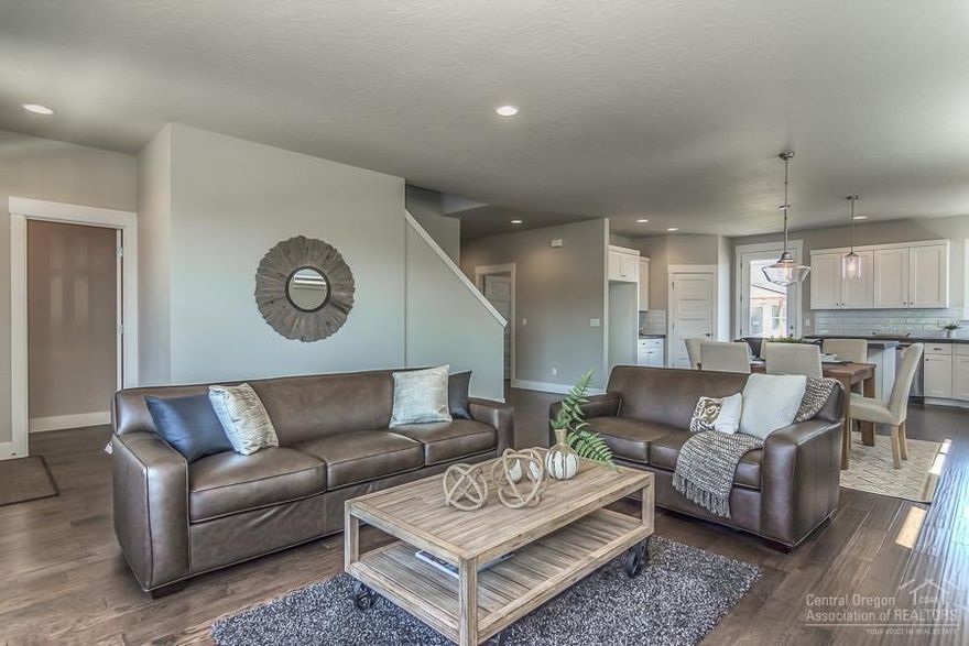 You will love this stunning modern farmhouse style home featuring a beautiful kitchen with stainless appliances, large breakfast bar and corner pantry. The hardwood flooring, 9' ceilings, and gas fireplace add to the warm comfortable feel. There is also a luxurious main level master suite. Earth Advantage certified home with a 2-10 Buyers Warranty. Model home open Thurs-Sun 11-4.