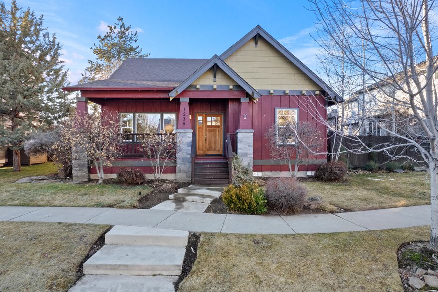 Charming Northwest Crossing Bungalow! 2031 square foot home has an open floor plan with large living area, vaulted ceilings, built-in cabinetry and cozy gas fireplace. Ample kitchen with loads of light. Center island and sliding glass door to the back yard and patio, ideal for outdoor entertaining. Large fenced back yard. Main floor has three bedrooms and two baths. Second floor has a large bonus area complete with half bath and Cascade Mountain views. Handy home office area off the kitchen. Hardwood floors, and multiple skylights. Laundry room off the two-car, alley-load garage. Freshly painted inside. Keep as-is, or enjoy decorating this to your liking.  Sip your morning coffee on the sunny front porch and relax on the back patio in the evening.  Close to all the neighborhood has to offer, and right in the heart of Northwest Crossing!