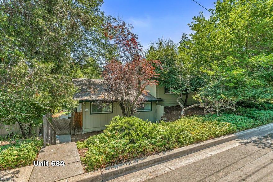 Attention Investors or 1st time home buyers. This one just got better! This Duplex has income potential all over it. A large lot with mature trees, located on a quiet street near the hospital. A rare find is that this property also has TID water rights for outside yard care. Both units have been remodeled with major upgrades including HVAC mini-splits systems for maximum efficiency and each with over 900 sq ft. Unit 682 has 2 bedrooms with a lower bonus room. Unit 684 has just been refreshed this month and ready for a brand-new tenant or move in yourself. Includes new plank flooring, new countertops with an additional wood block counter as well. The cabinets have just been painted and look fantastic. Each unit has indoor laundry hookups, private decks with mountain views and their own fenced yards. Other recent upgrades are exterior paint 2024, new roof 2019, newer water heaters 2019 & 2022. Decks were rebuilt in 2014.