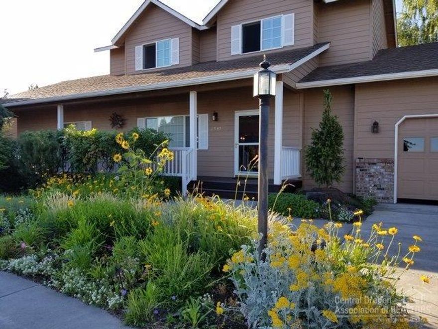 This beautiful, well maintained home is being offered by the original owner. Custom touches were added during construction. With just under 2000 sq.ft. it boast a large open great room with rock faced gas fireplace and a custom juniper mantle. The kitchen has hardwood floors, hickory cabinets, custom drawers and pantry. Master on the main with nice size bath. Walk-in closets in all 3 bedrooms. 2nd bedroom also has a large walk-in storage room. Hard to find 3 car garage with cabinets and work bench. This home is loaded with storage! Professionally landscaped back yard is an easily maintained beautiful English garden on a .21 acre lot. Decks front and back, sprinkler system. A/C. Close to schools, hospital, shopping.