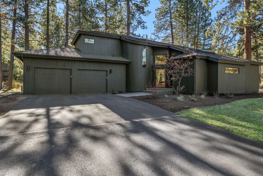 Stunning remodel in the highly coveted community of Sunrise Village. This hidden gem of a neighborhood is known for its expansive lots, towering pines and excellent proximity to all Bend mountain living activities. This Scandinavian inspired masterpiece sits among the trees on a large corner lot. From the moment you walk through the front door this home exudes a sense of comfort and calm. With a minimalist design and thoughtful finishes throughout, including heated tile floors and sauna in the primary bathroom to the wood burning fireplace in the great room, a perfect setting for quiet, cozy evenings at home. Gorgeous wide plank oak floors throughout the main living areas with high-end wool carpeting in primary bedroom and upstairs for luxurious comfort you can feel in every step. This truly one of a kind home comes with plans for an addition that includes a 3rd car garage, guest ensuite & bonus room above, adding approx. 550 sq. ft. of additional living space.