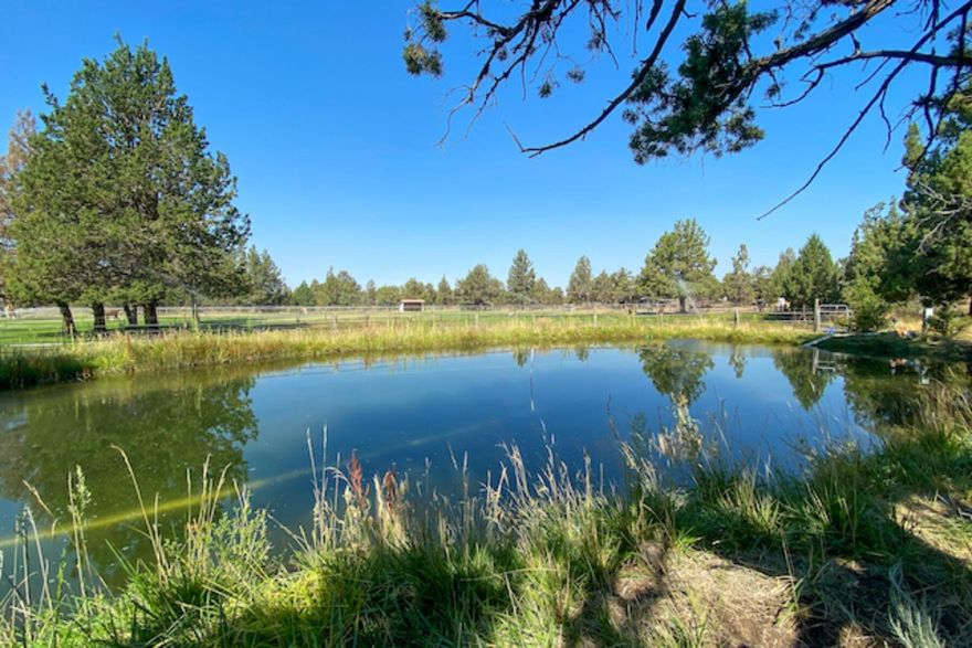 Many opportunities await you on this 72+ acre property featuring two homes, shop, equipment shed, barn and hay shed. Main home is 2336 sq ft with 3 bedrooms and 2 baths, an office, large living room and kitchen and dining area with lots of windows and a wrap around deck, two car oversized attached garage surrounded by irrigated pastures and a beautiful pond with a sandy beach area. Triple wide home is 2137 sq ft built in 1997 with 3 bedrooms and 2 baths, large kitchen and dining area open to a nice sized living room with a split floor plan. The barn has 7 stalls and a grooming stall, tack room and grain room, loft holds 14 ton of hay and has a fenced pasture off the back and paneled runs off the front. The shop has 220 power, concrete floor, two roll up doors and a wood stove and also houses the pressure tank and cistern in an insulated separate area. The equipment shed is 7 bays with a dirt floor. Be sure to view Ebook & LandID interactive map.  Too much to list!