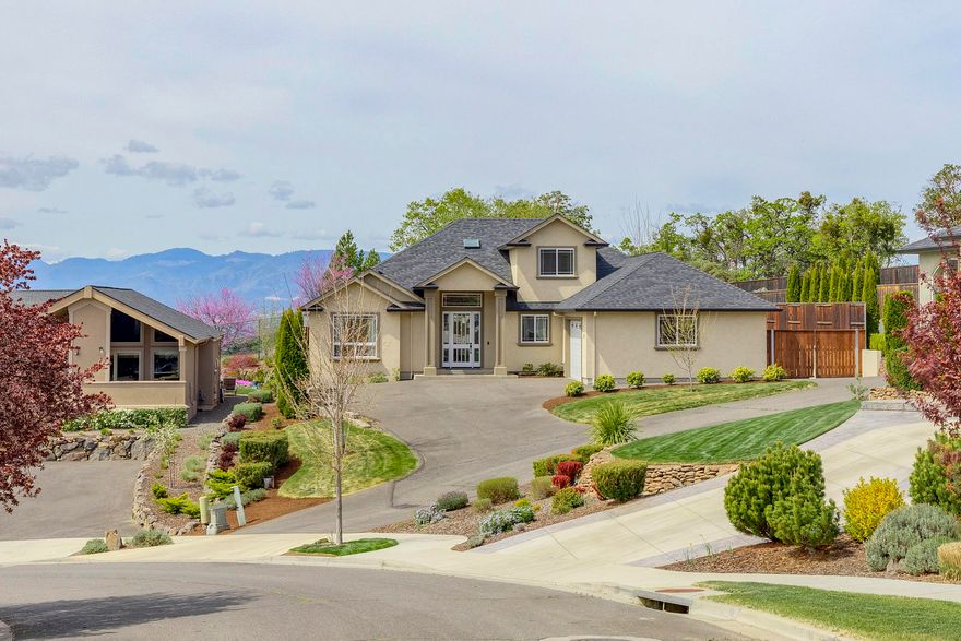 WOW! 5 bedroom, 3 bath, 3000 SF home on 0.28 of an acre with mountain and valley views. Entry has hardwood floor, tile inlay and accent lighting and crown accents. Living room has gas fireplace w/nitch for a TV up to 72 inches and triple crown moulding. Kitchen has large pantry, beautiful white cabinets w/ under cabinet lighting, unique black granite countertops, large center island and stainless appliances. Dining room with mountain views and decorative ceiling treatments. Huge master bdrm w/ walk-in closet, large master bathroom w/ marble, walk-in shower, 6 ft soaker and accent lighting. Also on the main floor are 2 other bedrooms w/ walk-in closets, the 2nd bath and laundry room with sink. Upstairs has 2 bedrooms, full bath and bonus area. Covered patio w/ gas. Paved RV parking with hook-ups. 2 heat / AC systems and landscaped.