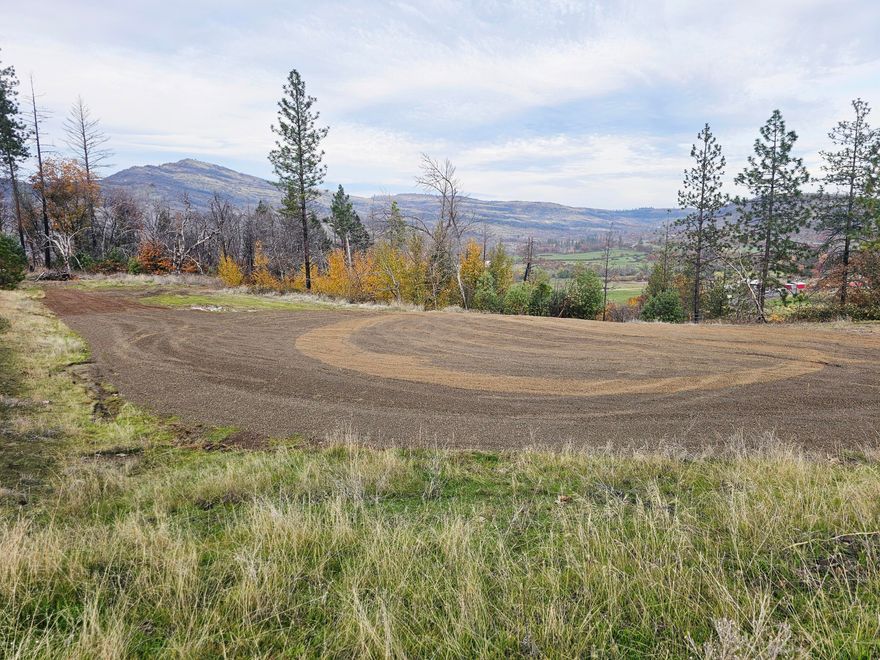 Come build your dream home on this scenic 10.76 acre parcel. EFU zoned with gorgeous views of the surrounding valley, rolling hills and mountains. This incredible property features a well graded and graveled driveway that curves to three freshly cleared/graded pads. A blend of open space, hills and a variety of oaks, pines and madrone. Per Jackson County Planning Dept property does have a vested homesite approval and an approved site evaluation for septic. Per seller property has a good producing well with a newer wellhead. Electricity is currently not hooked up but available at the road. Property is just past the 2-mile marker on Butte Falls Highway, about a 10 minute drive into the town of Eagle Point. Bring your vision and check out this piece of land. Buyer to do their own due diligence and verify all aspects of the property including uses, zoning, approvals and building requirements.