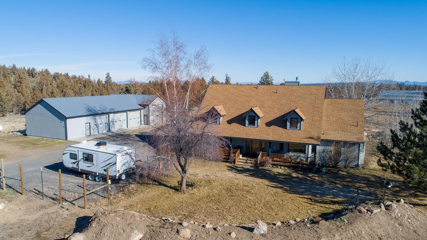 Beautiful 4 bedroom, 2.5 bath home with 2957 sf of living space on this 5.85 acre home with Cascade Mountain views. This home features a large primary bedroom on the main floor that has amazing views of the Cascades. Property features include home office, hobby room, and additional bedrooms upstairs with a Jack & Jill bathroom and bonus room. A heated workshop, indoor RV parking with/30AMP service with additional 30/50AMP RV service outside the shop. Commercial grade 30x72 greenhouse with 65000BTU propane heater, fan & Louvers temperature control system. This land includes 2.5 acres of irrigated rights, fenced and cross fenced.