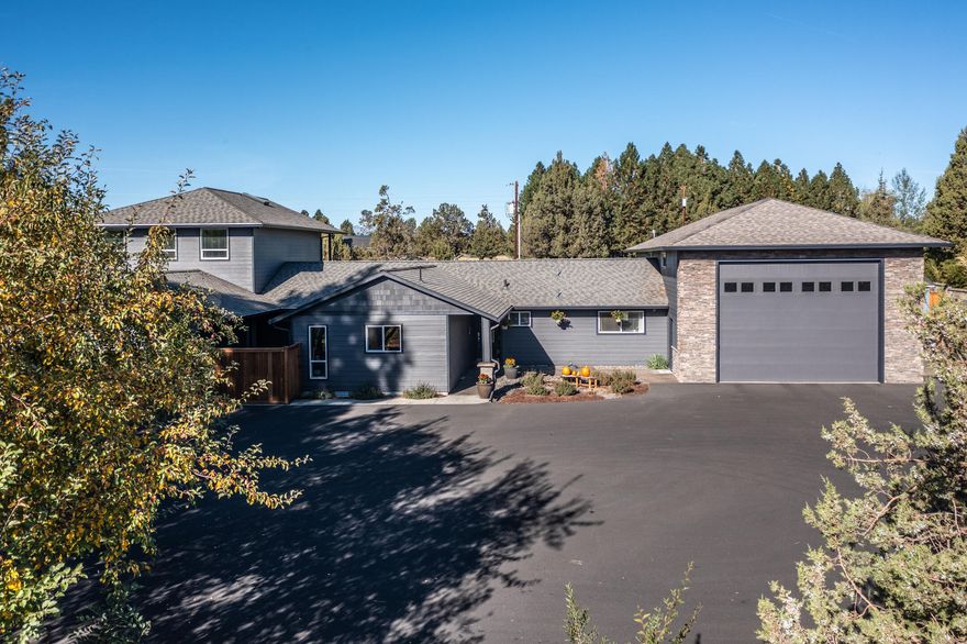 This one checks all the boxes! Relax & enjoy country living w/serenity & spaciousness on ¾ acre, conveniently 2.5 miles to town & amenities. Property boasts Main 3464 sqft house w/4 bdrm/4ba, PLUS a NEW, approx 775 sqft, 1bd/1ba Guest Qtrs. & a small studio building for perhaps yoga, office, wine tasting, painting, crafts, etc.  Upstairs bonus rm can function dually as office & for entertaining w/an amazing theater screen, wet bar, beverage refrig, & covered upper deck w/peekaboo mountain views (no guarantee for future viewing)!Home is set up to work remotely: once owned by an electrician, the residence is loaded w/a Leviton smart home system including security cameras, sound, HVAC, holiday lighting, & more. Plenty of room for your RV/boat/cars in a 1500+ sqft, heated garage equipped w/outlets, electric lift, pre-wired electric car charging, 2 RV dumps/hook ups(inside/outside), & room for gym/shop etc. Main property may qualify for short term rental in county, buyer to do due diligence