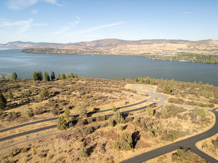 Discover your dream homesite in RidgeWater, one of Southern Oregon's most exclusive gated communities. This .53-acre lot offers panoramic views of Klamath Lake and the surrounding landscape, making it one of the most desirable parcels in the neighborhood. Wake up to stunning sunrises and enjoy peaceful moments overlooking the lake from your future backyard. Located just minutes from town, RidgeWater provides the perfect balance of privacy and convenience, with easy access to Southern Oregon's best outdoor recreation—fishing, boating, hiking, and more. The lot is already cleared and utilities are nearby, so you can begin building your custom home without delay and start enjoying the lifestyle this special setting has to offer.