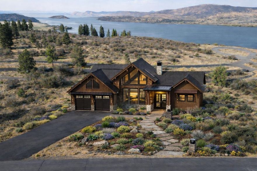 Discover your dream homesite in RidgeWater, one of Southern Oregon's most exclusive gated communities. This .53-acre lot offers panoramic views of Klamath Lake and the surrounding landscape, making it one of the most desirable parcels in the neighborhood. Wake up to stunning sunrises and enjoy peaceful moments overlooking the lake from your future backyard. Located just minutes from town, RidgeWater provides the perfect balance of privacy and convenience, with easy access to Southern Oregon's best outdoor recreation—fishing, boating, hiking, and more. The lot is already cleared and utilities are nearby, so you can begin building your custom home without delay and start enjoying the lifestyle this special setting has to offer. *Some photos have been virtually enhanced to show what a potential home could look like on this build site*