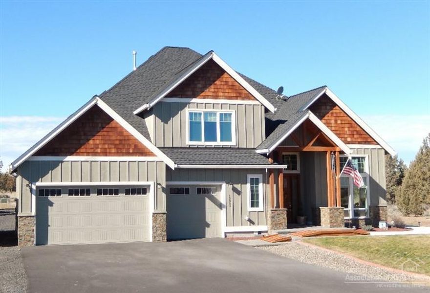 High Desert Country Estate! This quality built home on 5 acres, wows, with 12' tray ceilings in nearly every room, a spacious entry, and a formal dining room. The open gourmet kitchen features a vegetable sink in the island, black granite counter tops, walk-in pantry, bar area and views of the Cascades. For the toys that don't fit into the 3 bay garage, put them in the 40' x 36' shop with a 16' RV door and a 10' door. Your wheels will never get dirty on the asphalt circular drive!