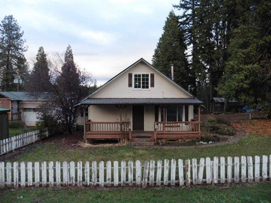 Lots of potential with this quaint cottage located in Butte Falls. Offers a fenced yard and 1 car attached garage. Inside offers 2 bedrooms and 1 bathroom and additional sq ft upstairs, an open kitchen and large livingroom. Bring your tool bags and make this one yours!