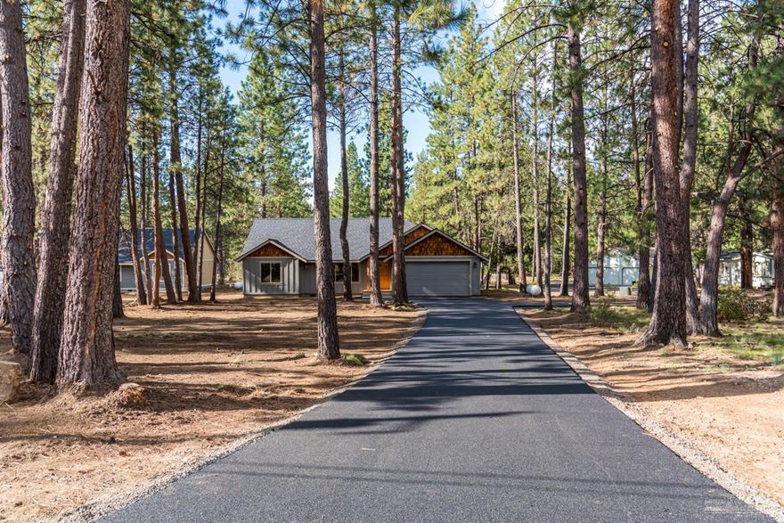 New construction in Deschutes River Woods on almost a full acre with paved road and driveway with plenty of room to add a shop. This 1810 sq. ft. single level quality home has an open floor plan and vaulted ceilings. Features include hardwood throughout entire kitchen/dining/great room, quartz countertops,stainless steel appliances, skylights, propane fireplace, tile bathrooms and master shower. Quick access to Old Mill, downtown Bend and Highway 97. Listing agent is related to seller.
