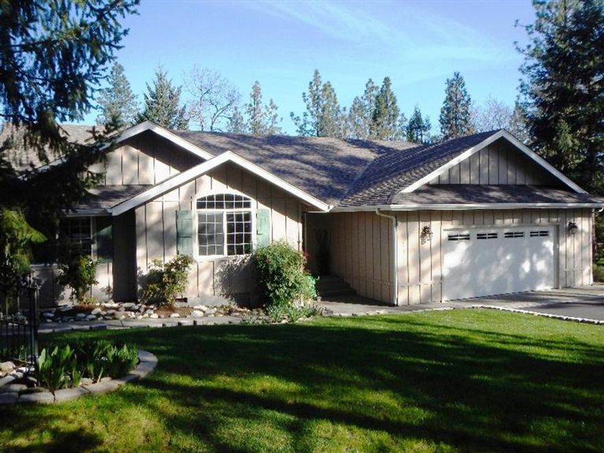 Gorgeous rural setting, mountain views in desirable Colonial Valley. Just minutes to town. Beautifully maintained single level home built by Eastwood Homes in 2000. Remodeled in 2007. This 3 Bed 2 Bath 1945 sf home features a split floor plan w/vaulted ceilings. Large open kitchen w/maple cabinets, Corian counters, center island & a breakfast bar in addition to a built-in open shelving unit. Large laundry/pantry room with utility sink & lots of storage in the maple cabinets. Family room features a gas fireplace with rock surround flanked by built-in maple shelving. The spacious living room has wainscoting & view of the large covered cedar deck & backyard. Master bedroom has walk-in closet & sliding glass doors to access your deck. Over-sized attached two car garage. 24x24 finished shop w/separate paved driveway along with a 8x12 framed garden shed. Deer-fenced raised garden beds with automated drip system. Deer-fenced back yard. 1.0 acre beautifully landscaped with 90% perennials.