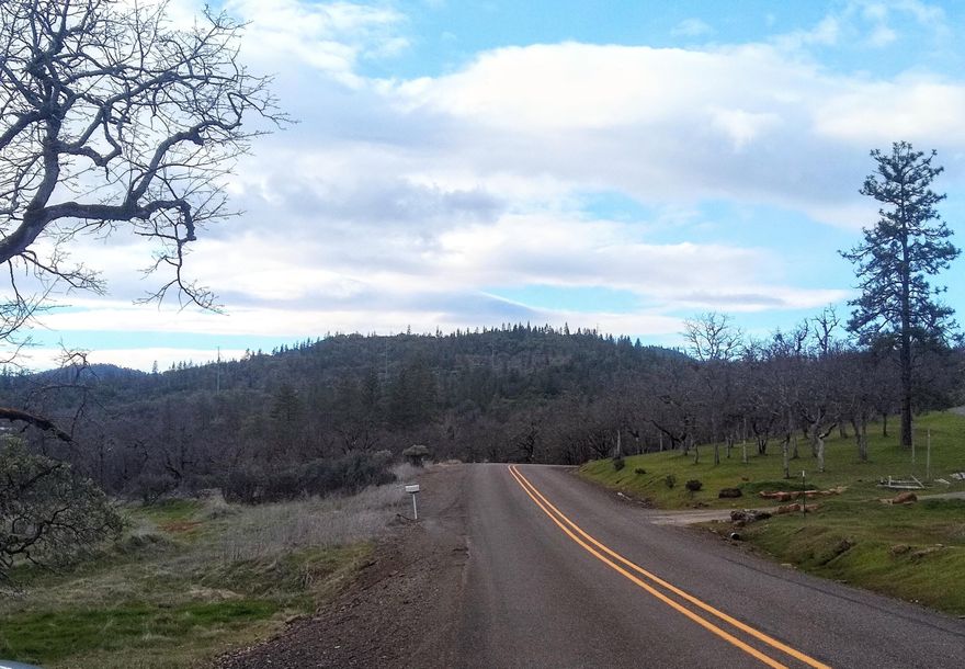 You found it!  Own your own mountain!  Non-expiring homesite, leveled and clear with 2 wells!  Views of both Upper and Lower Table Rock and foothills all around.  The road traverses, up over the lower summit, then down around the perimeter before going to the peak providing views in every direction!  Zoned Woodland Resource (WR) and elevation from 1600 to 2000 feet for the coveted ''above the fog but below the snow line.'' A great mix of hardwood oaks, madrone, and conifers, with stunningly beautiful views depending on where you are on the property.  Too many, mostly level and usable, areas to count.  Multiple sand deposits throughout the property.  The homesite in the lower southeast corner is a short drive down to the road making easy passage in inclement weather.  Multiple seasonal creeks and at least one pond.  Wells produce 1 GPM and 0.75 GPM.  This is the place you've been looking for!  Come and build your dream here. Who knows?  Maybe you can name your own mountain? Call today!