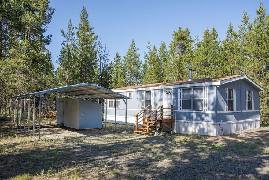 Discover peace and potential on over 2 acres at 15890 Parkway Dr in La Pine. This lovingly restored 1982 manufactured home is clean, comfortable, and move-in ready with 2 bedrooms, 2 full baths, fresh paint inside and out, newer carpet, new exterior steps, detached carport, and storage sheds. Cozy up by the wood stove or enjoy the charming dining nook. All appliances are included—fridge, dishwasher, microwave, washer, and dryer. The home has been moved twice and may qualify for VA financing or is ideal for a cash buyer. A newer 1000-gal standard septic and private well (both installed in 2007) provide reliable infrastructure. Use as a full-time residence, weekend retreat, or live in while you build your dream home. Located in a quiet area of well-kept homes near paved Day Rd, with easy access to lakes, trails, and all things Central Oregon. A flexible and affordable opportunity in La Pine!