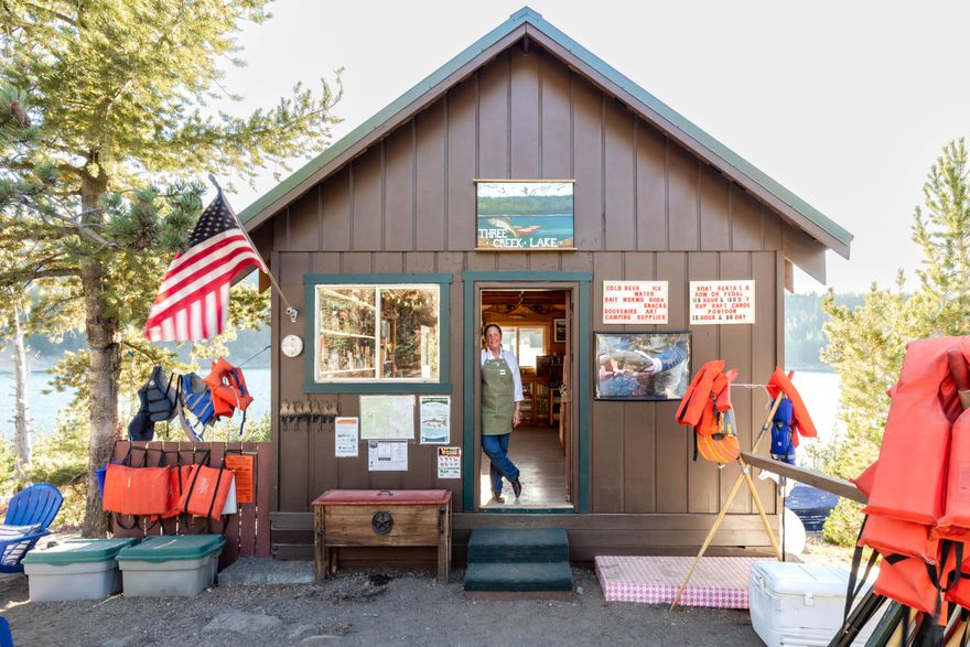 Once-in-a-lifetime opportunity! On the shores of a 28-acre alpine lake, the Three Creeks Lake Store and Marina is now available!  At 6,550 ft in the Deschutes National Forest, this beloved alpine business has served generations of outdoor enthusiasts and has steady visitors for fishing, boating, hiking, and camping.  The cabin-style building houses a stocked general store with camping supplies, snacks, drinks, apparel, and local art, plus a full marina with canoes, paddle boards, fishing gear, and tackle. The property—the only cabin or structure on the lake—sits on just under an acre, offering a private camping spot, and is on a Forest Service lease, transferable with approval. Currently operated seasonally from Memorial Day to Labor Day, weather permitting.  It can possibly be operated year-round with Forest Service approval. Turn-key, low-overhead, and irreplaceable—this is a rare chance to own a piece of Oregon history.