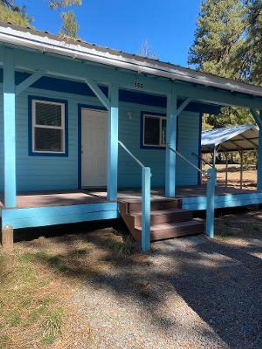 Adorable cottage.1 bedroom 1 bath built in 2017 new flooring, new paint on inside.  This is well kept and really nice for single person or rental. Corner Lots 9 - 11.  Three lots that are adjoined tax lot.  Detached Single Carport.  Many opportunities for this property.  You could build on or build a shop.  Plenty of room.