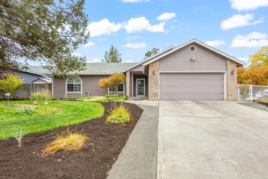 Welcome home to this beautiful 3 bedroom, 2 bathroom gem, perfectly situated on a desirable corner lot. Step inside and be greeted by the warm glow of stunning tiger hardwood floors that flow throughout the main living space. The airy feel is enhanced by elegant vaulted ceilings, creating a spacious and light-filled atmosphere. Gather around the cozy gas fireplace in the living room for effortless warmth on a cool evening. The large, private back deck is ready for everything from your morning coffee to evening entertaining. Plus, a convenient backyard storage shed provides ample space for tools, hobbies, or seasonal items. With a sought-after layout and location, this house is ready to be your perfect sanctuary.