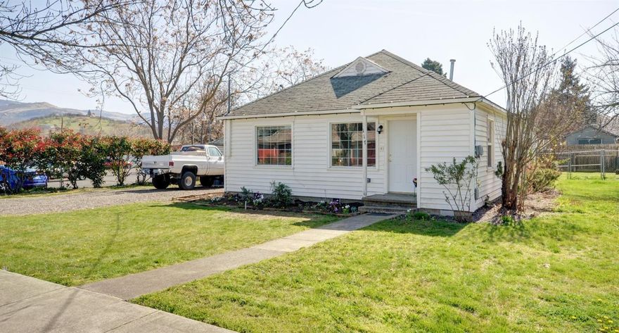 Come check out this wonderful home with commercial office potential! Located in the beautiful city of Phoenix, this charming 4 bedroom 2 bath home will steal your heart. Original Hardwood flooring throughout the main living and bedroom areas, large kitchen perfect for those who love to cook. A fully fenced back yard and a detached two car garage complete this package.