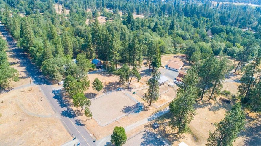 Have HORSES and extended family? Perfect solution! 2 homes, each on a legal flat 2.5+ ac tax lot for a total of 5.08 level acres fenced for horses. Huge new Noble barn & Noble 85'x100' paneled arena. Riding trails within a few miles. 
Main home is a spacious 1896sqft ranch style home w/3 BR, 2 baths, pantry, living room, family room, dining area and bright kitchen. Heat pump & ducting 4 yrs old, all newer appliances, covered decks & hot tub . Chain link fenced side yard serves as a huge dog run with pasture area in the back.
SECOND home is a 1008sf 1980 manufactured home w/2 BR, 2 baths, with decks and large storage room built next to MH on deck.  Home is presently rented.
Each home has a barn-like garage with a loft and workshop area.  Arena is on 2nd tax lot.
Live in a family compound, or rent one of the dwellings out.  Lots of privacy either way.  Properties have been surveyed!  Home Warranties can be included, if requested, upon an acceptable offer!  Ask to see videos and 360 tour!