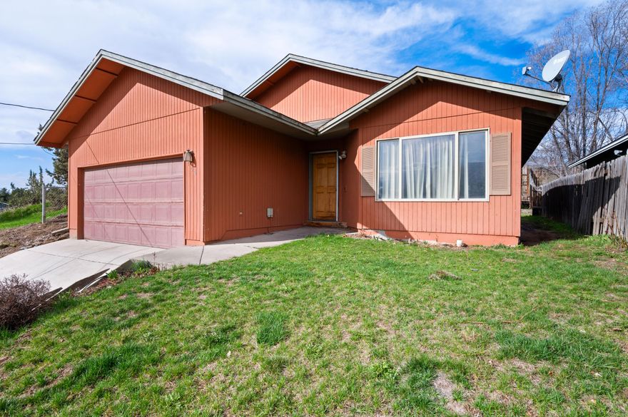 This home is a fantastic opportunity for investors and first time buyers alike! Offering 1,288 sqft of living space, this three bedroom, two bath home has already undergone key updates, including a brand new furnace, installed in 2023 for enhanced comfort and energy efficiency, along with new flooring throughout. It's the perfect canvas to personalize and build instant equity. Additional features include a spacious double car garage and a convenient door from the dining room that leads to the fully fenced backyard. With pavers already in place, this outdoor space is ideal for relaxing, entertaining, or creating your dream garden. Ideally located just minutes from town and shopping, this charming property offers both convenience and endless potential. Whether you're seeking a smart investment or a place to call home, don't miss out - contact your favorite agent today to schedule a showing!