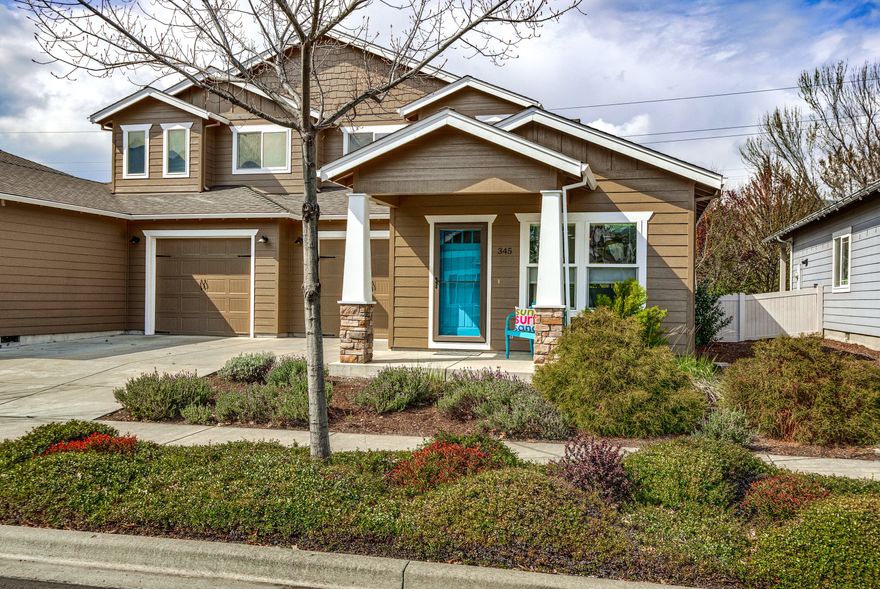 Easy living in this stylish two bedroom, two bath home in the Meadowbrook Park Subdivision in beautiful Ashland Oregon.  Great layout with one spacious bedroom and bathroom on the main level and the other large bedroom suite upstairs.  Living, dining area and kitchen are all open to one another and have wood floors.  The kitchen has granite counters, stainless steel appliances and access to the lovely backyard covered patio and fenced-in yard.  Upstairs primary suite has amazing views looking back towards Mt Ashland, private bath and a versatile office nook at the top of the landing, also with views looking back towards Grizzly Peak.  Fresh exterior paint, as well as the fun and cheery colors throughout this lovely home.  Home is turn-key and ready to go.  Great location and neighborhood with a park, walkways and the creek flowing by.