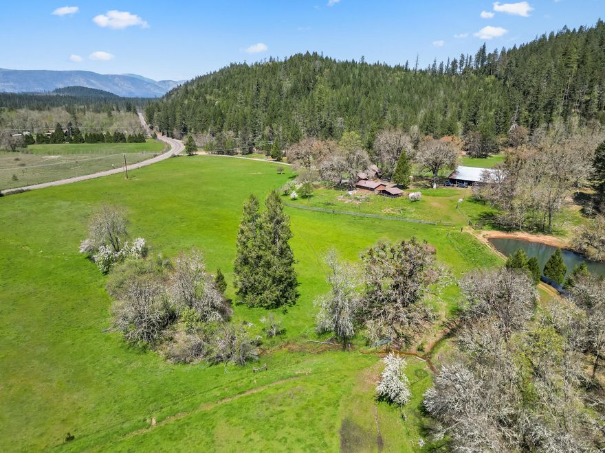 Experience the beauty & tranquility of Winter Pond Ranch! Just under 40 Acres, this property borders over 400 Acres of BLM! Nestled in a picturesque setting, the ranch is fenced & cross-fenced & features three ponds, 22.8 acres of valuable water rights, a spring, & two wells! The lodge-style, 3 bed/2 bath home with its Redwood siding is designed for comfort & warmth w/its rich woods & vaulted ceilings. The home features a spacious living room & kitchen, as well as a large bonus room w/bath. It very easily be converted to a Master Suite by just adding a closet. Additionally, there is a lovely, screened in porch off of one of the bedrooms. Outside, enjoy peaceful mornings on the deck & don't miss the large barn, detached garage, custom chicken coop, garden area, & fruit trees! Whether you're looking for a private homestead or a working ranch this property provides endless possibilities! Don't miss a rare opportunity to own a rare gem in the heart of Southern Oregon's scenic countryside!