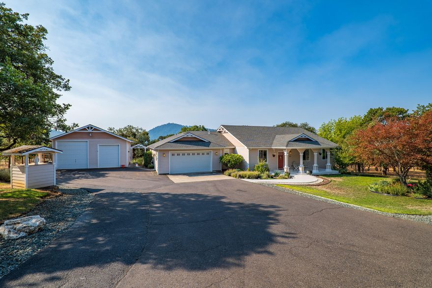 Contemporary Colonial Valley View Home.  First Time on the Market.  Split bedroom floor plan,  4 bdrm 2 1/2 bath 2359 Sqft built in 2004.  Living room features vaulted ceiling and gas fireplace.  Kitchen sports  Granite counters and maple cabinets.  Sunny Breakfast nook, plus formal dining.  Spaciouse Master with 9' ceillings, master bath with jetted tub, tiled shower, dual vanity.  3 additional bedrooms and hall bath.  Beautiful Deck overlooking the Valley.   Double garage, and 880 Sqft RV garage.  Landscaped with automatic sprinklers.