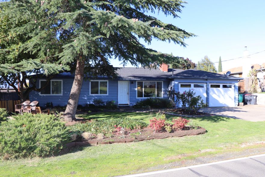 Absolutely beautiful single level home located in a desirable Medford area, close to schools and shopping. This home features a large primary suite with nice built in cabinets,  2 closets and a large primary bath with dual sinks and large walk-in shower.  Lots of natural lighting through-out.  Beautiful views looking out the living room towards RoxyAnn mountain. Stay nice and cozy by the gas fireplace. All original hard wood floors.    Kitchen was remodeled in 2015 opening up to the living area with all new soft closed cabinets, pantry, counters tops, tile flooring, stainless steel appliances with a gas range/dual ovens. Off the kitchen bonus room with bamboo flooring, making it your play/exercise room. Laundry closet is right off the kitchen with automatic lighting and shelving. New HVAC system in 2021.  New roof in 2015. Have fun in your large backyard with your gardening, greenhouse, 3 apples, 1 peach, 1 plum, 1 apricot trees and 3 different kinds of grapes. Home is move in ready.