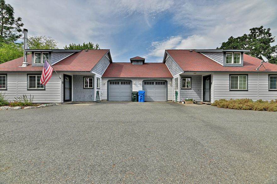 Charming Duplex in the Heart of Cave Junction! Well-kept 2-bed/2-bath duplex with mirrored layouts (Unit B shown here), each featuring vaulted ceilings, skylights, washer/dryer, and attached garage. Recent updates include durable flooring, efficient heat pumps, and low-maintenance finishes. Both units privately fenced, with Unit B offering a larger patio for outdoor living and entertaining. The property sits on a generous lot with ample parking and a detached shop/storage building. Located just steps from schools, Jubilee Park, and downtown conveniences, while still tucked back for peace and privacy. Strong rental history with long-term tenants makes this an excellent investment or a chance to live in one unit while generating income from the other. A rare opportunity in a desirable, walkable location!