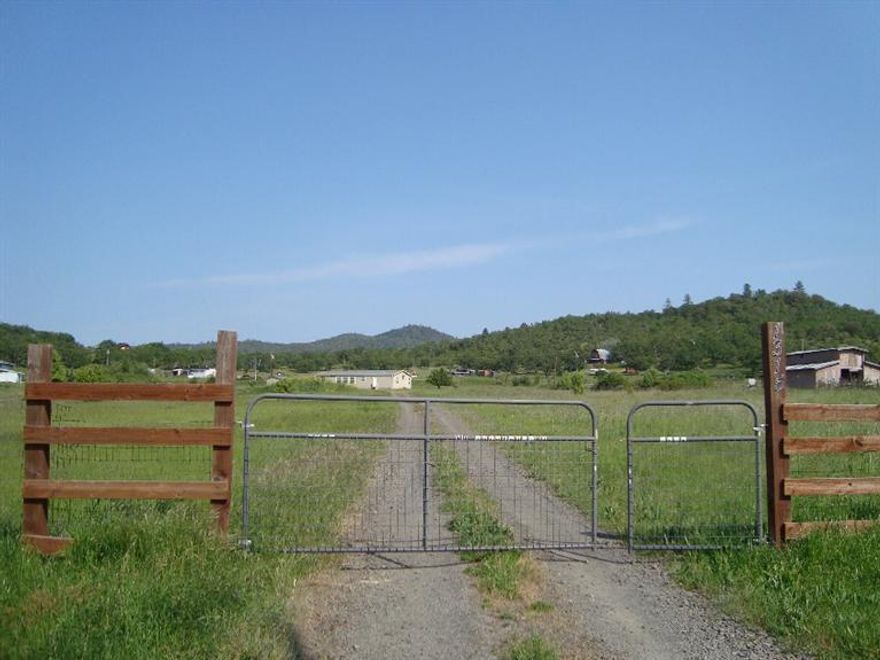 Southern Oregon Ranchette located on 5 Irrigated Acres with views of Agate Lake and the Beautiful Rogue Valley Mountains. This darling home has an open floor plan with split bedrooms. Wall to wall windows in the living room to capture the views! The storage shed is ideal for the tools or a tractor. Priced to sell and a gem to be had!