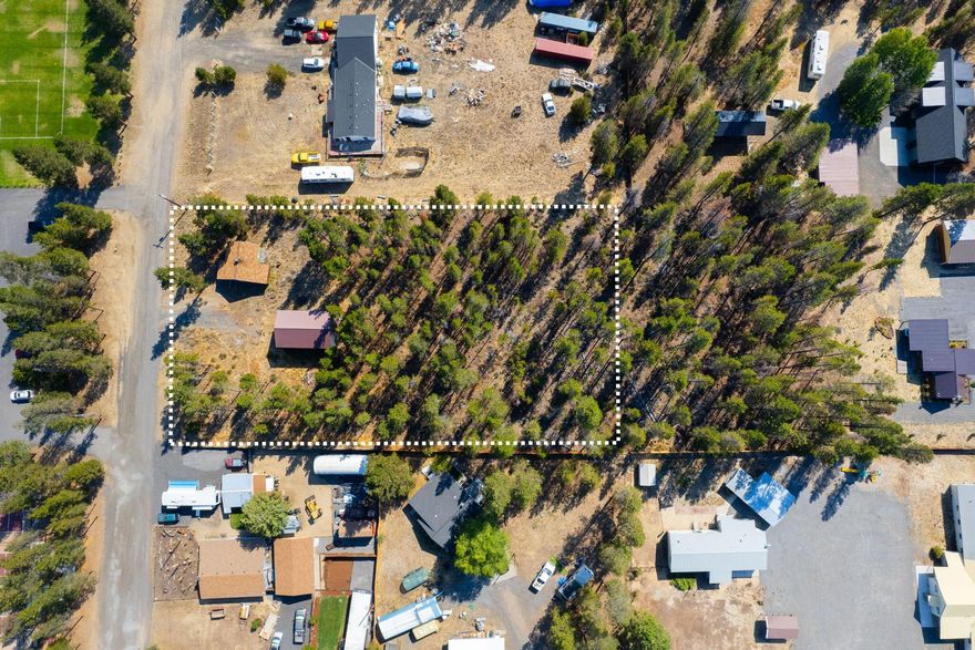 Discover this remarkable 1+ acre wooded haven, less than 0.5 miles from Hwy 97 and LaPine's downtown. It's prepped with public water, electric, sewer, and an 800 sq ft powered shop. Convenience is unbeatable - shop, dine, and explore with ease. Plus, it's right across from Finley Butte Park, offering fun outdoor opportunities. Ideal for your dream home or project. This lot may be eligible for partition into 2 or more lots. Buyer to perform due diligence regarding any future or additional development opportunities to the property.
