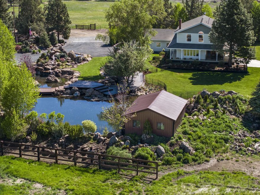 Stunning Cascade Mountain Views from home and property in the desired Tumalo area. This beautiful oasis has a one of a kind water feature with several waterfalls, ponds, stream, mature landscaping, tree stand and gazebo with bar/propane heat for outdoor entertaining. The property is 13.05 acres with 11 acres of TID water rights for pastures for livestock. The home features a covered porch, is 2850 sq ft with 3 bedrooms, 2.5 bathrooms, living room with views, dining area, office area, bonus room upstairs, basement game room/storage, attached 2 car garage with inside/outside dog kennel in a portion of the backyard. Outbuildings include shop with loft and equipment shed. The setting on this property is breathtaking and ready for any recreational lifestyle!